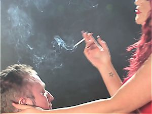 ginger-haired biotch dominates a guy while smoking
